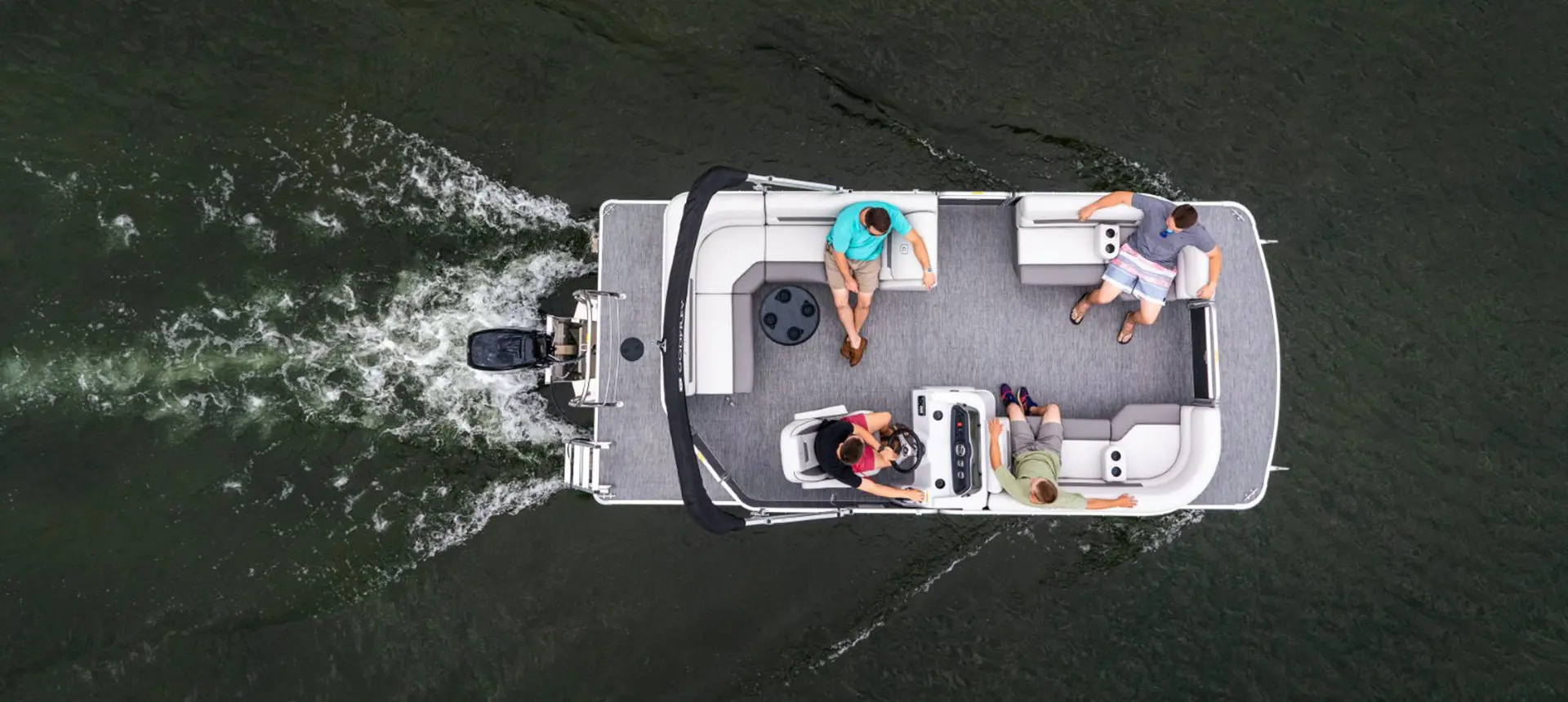 aerial view of a godfrey xperience cruise pontoon on a lake