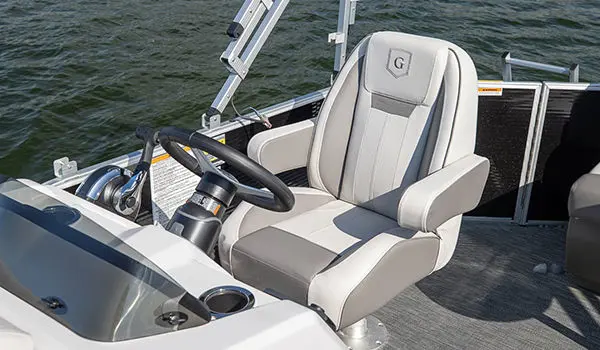 captain's chair and helm on a godfrey xperience cruise pontoon