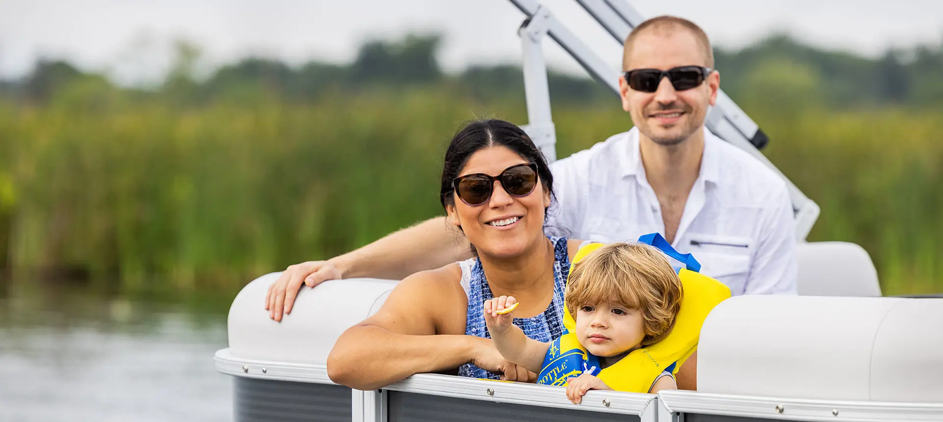 family having a good time on a godfrey xperience split bench pontoon