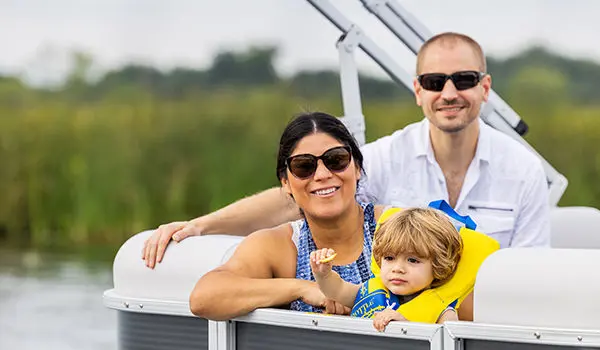 family having a good time on a godfrey xperience split bench pontoon