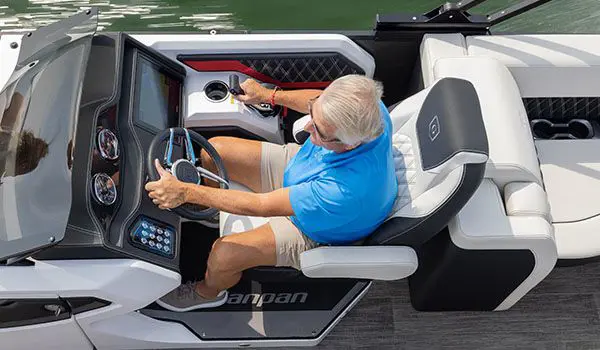 overhead view of a man at the helm of a godfrey sanpan series pontoon