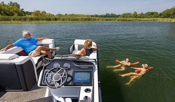 kids swimming by a godfrey sanpan series pontoon