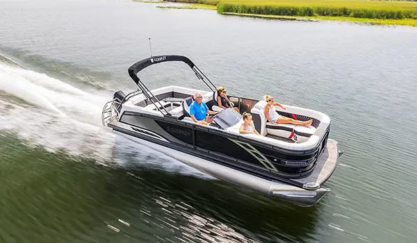 side view of a godfrey sanpan series pontoon cruising on a lake