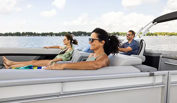 family relaxing on a godfrey aquapatio entertainment pontoon