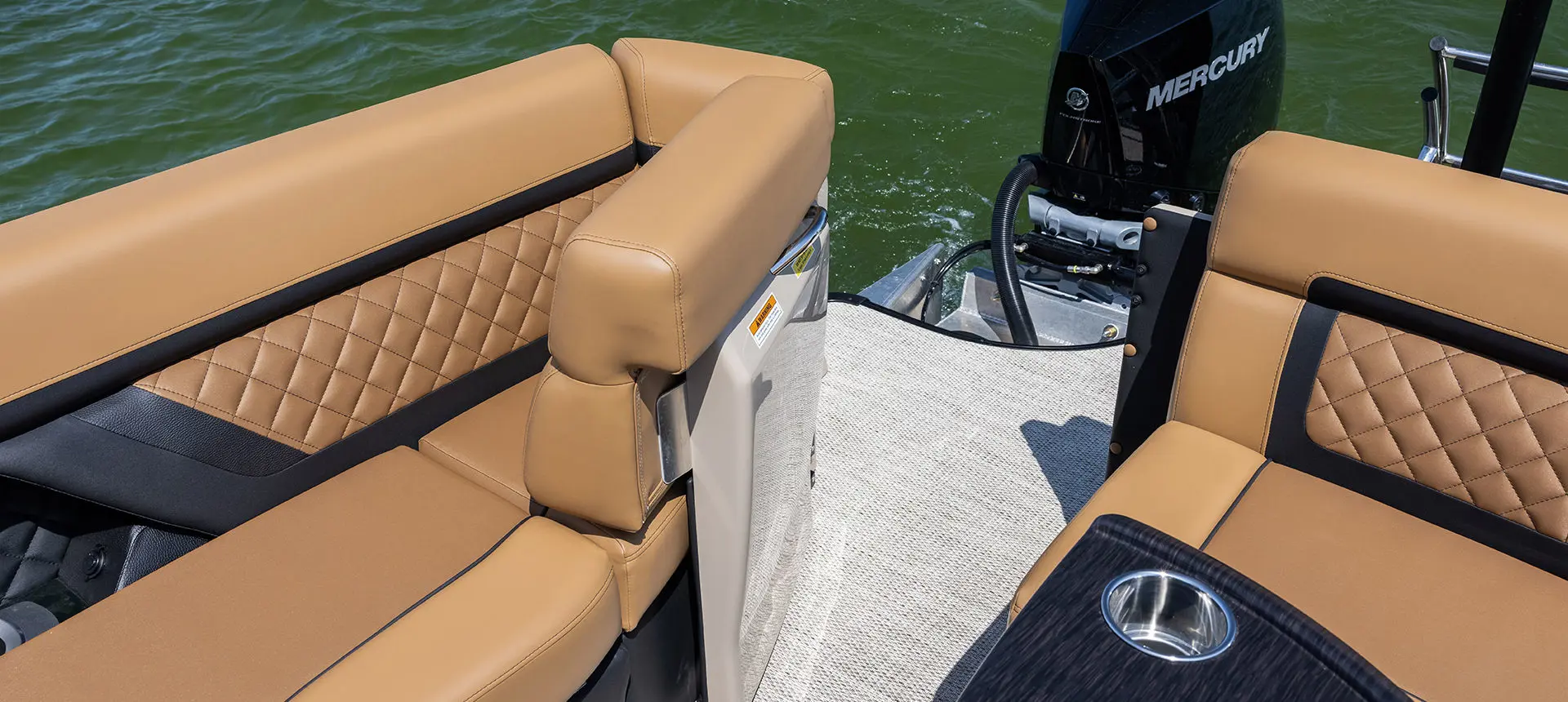 Stern gate opened up on a Godfrey AquaPatio Lounge pontoon boat.