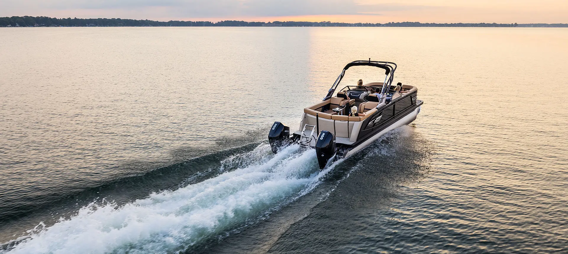 Rear view of the twin engines on a Godfrey AquaPatio Lounge pontoon boat.