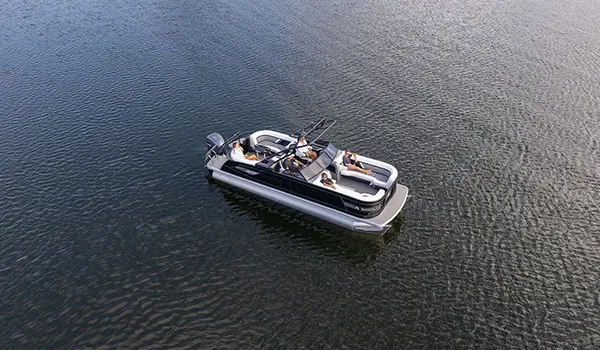 aerial view of a godfrey aquapatio winshield pontoon floating on a lake
