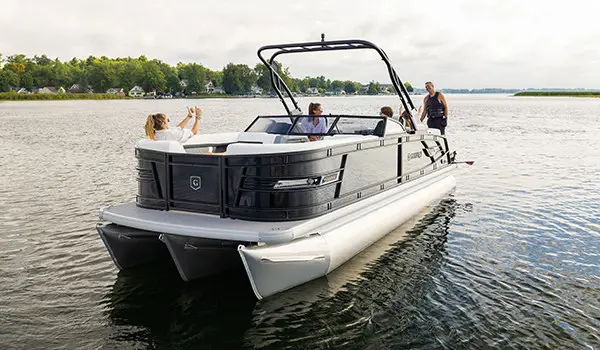 girl giving thumbs up to her dad on a godfrey aquapatio winshield pontoon