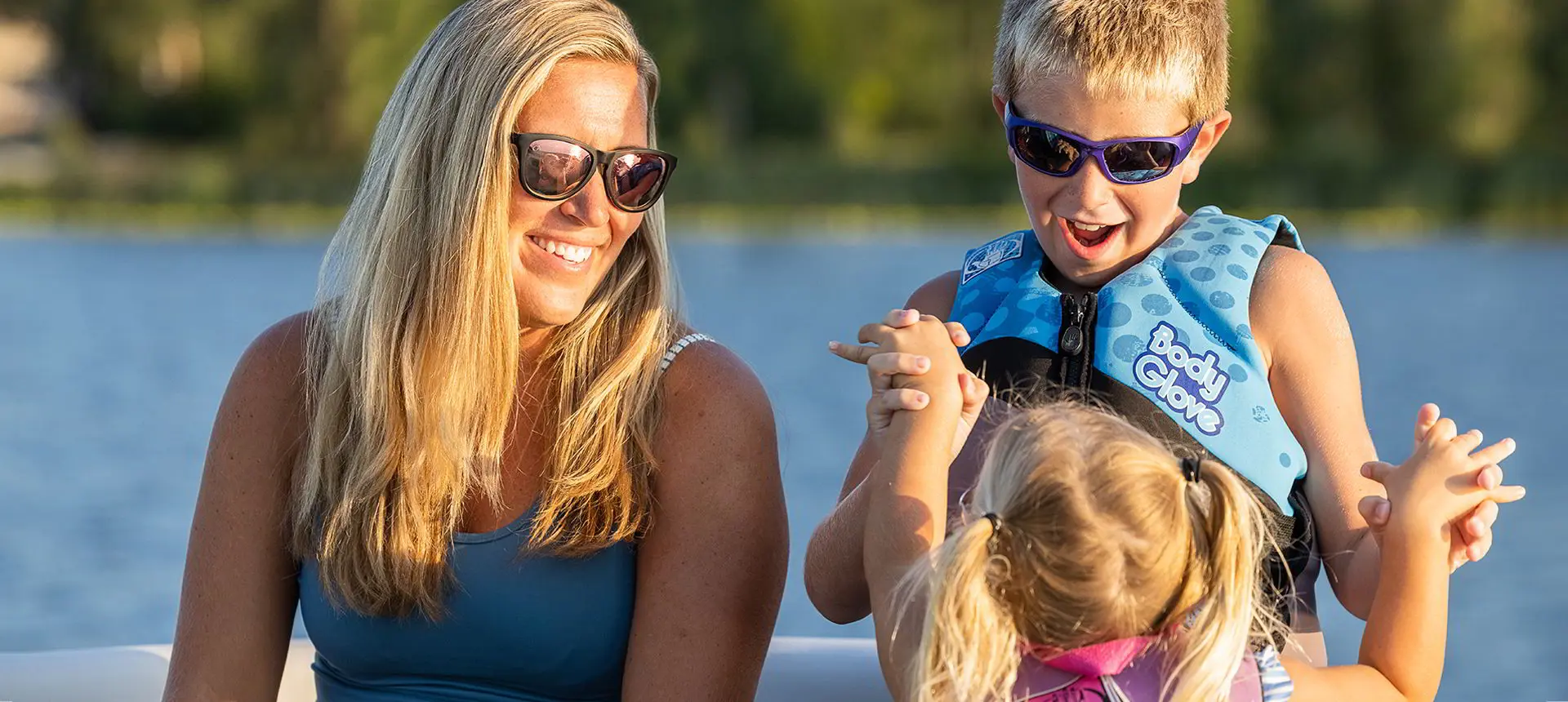 Kids and mom having a good time on a Godfrey Mighty G Cruise pontoon boat.