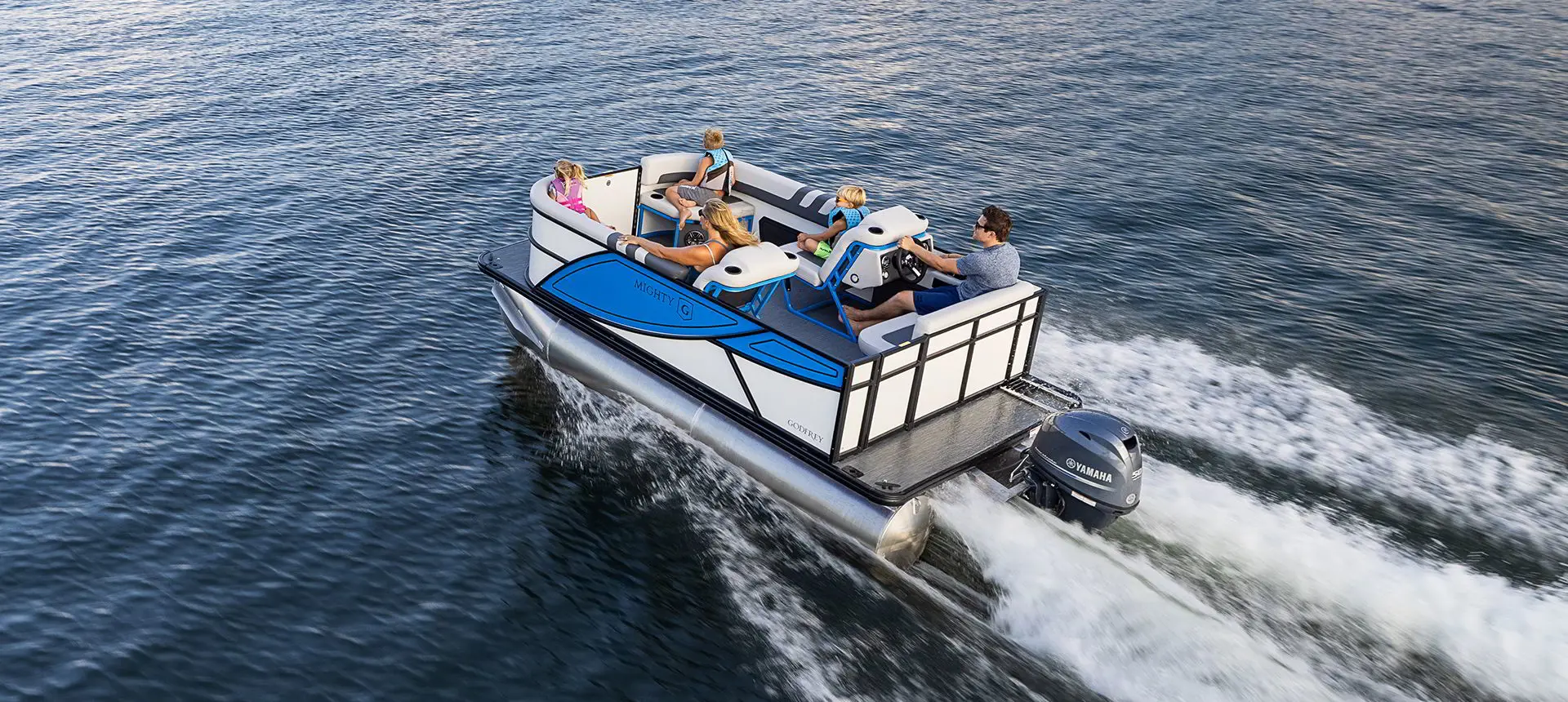 Rear view of a Godfrey Mighty G Cruise pontoon boat on a lake.