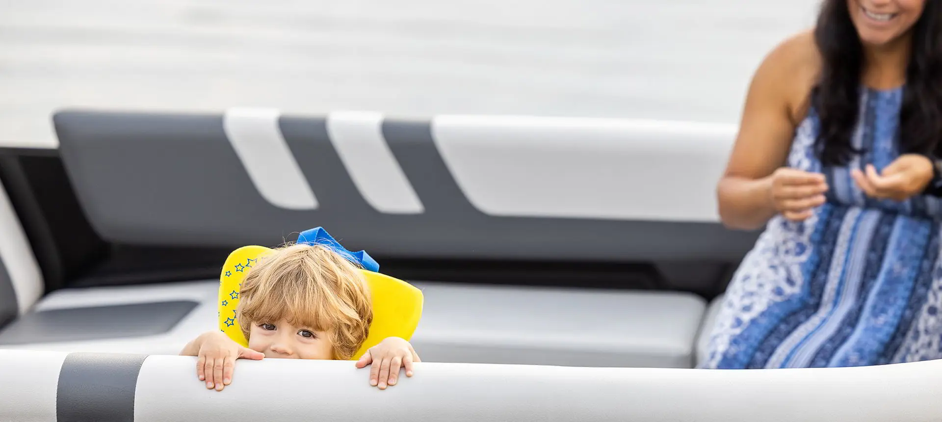 Kid having fun on a Godfrey Mighty G Cruise pontoon boat.