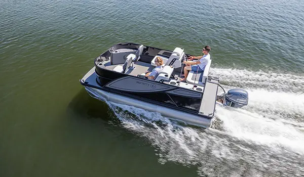 Aerial view of 2 guys cruising to their fishing spot on a Godfrey Mighty G Fishing pontoon boat.