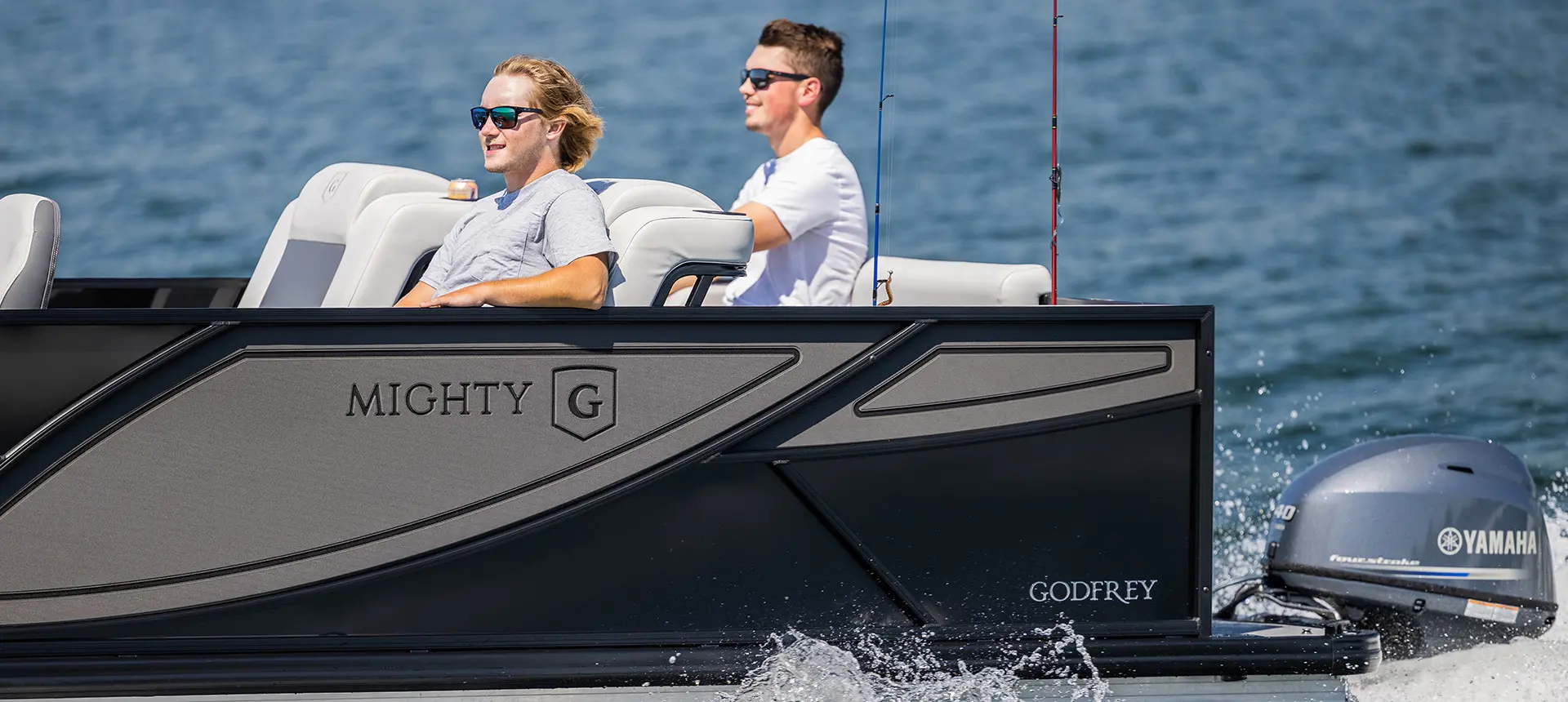 2 guys relaxing on a Godfrey Mighty G Fishing pontoon boat.