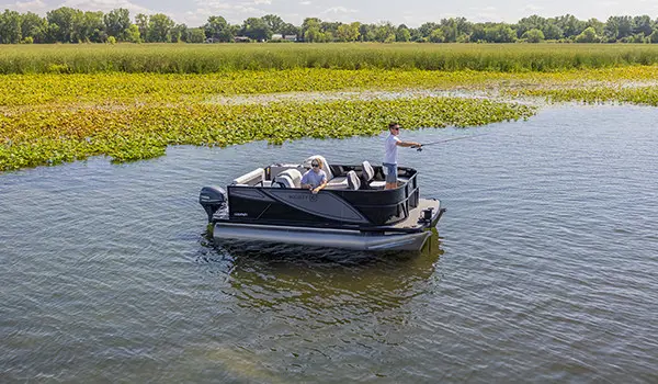 Guys fishing off the bow and side of a Godfrey Mighty G Fishing pontoon boat.