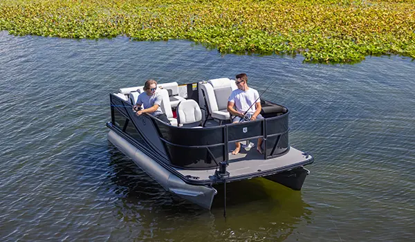 2 men fishing off the bow of a Godfrey Mighty G Fishing pontoon boat.