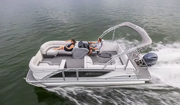 couple having fun on their godfrey monaco cruise pontoon