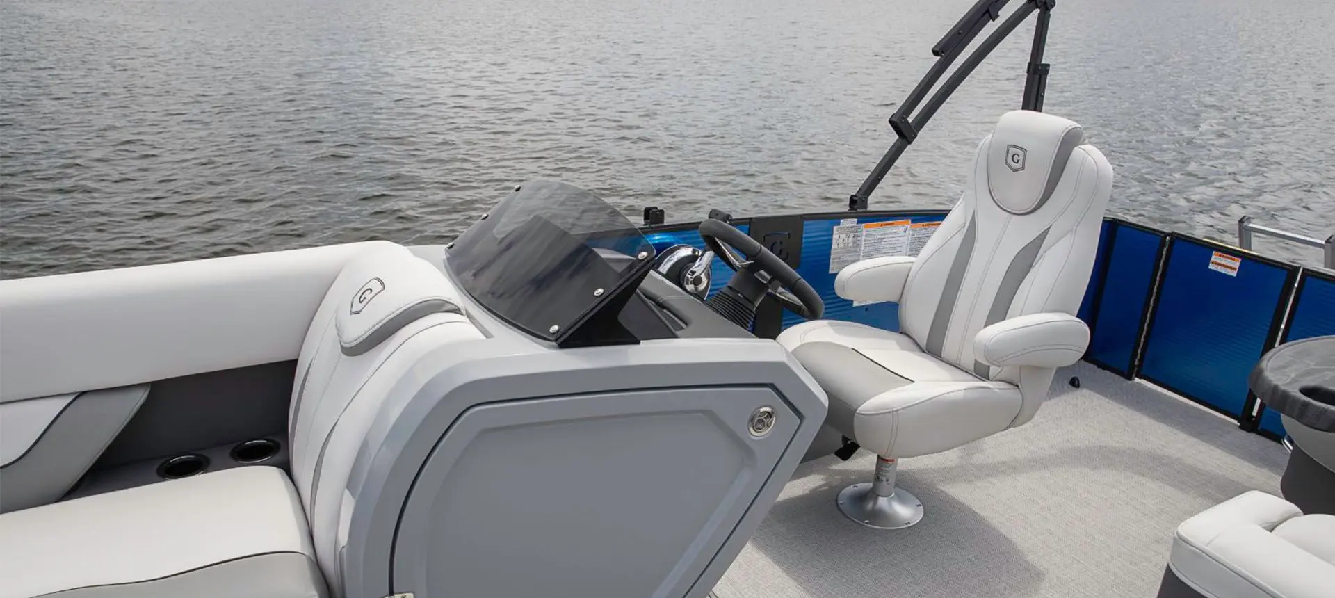 captain's chair and helm on a godfrey monaco cruise pontoon