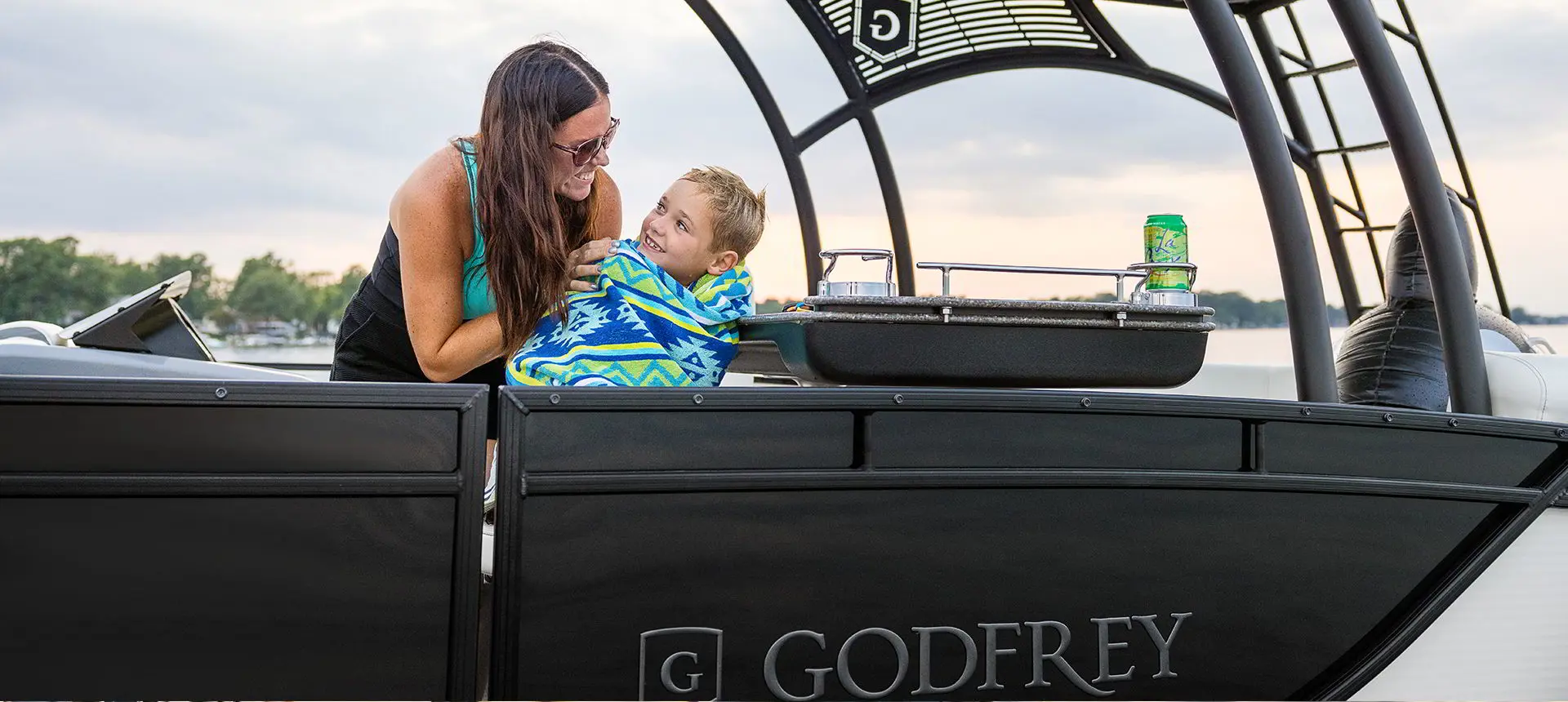 mother and son on a godfrey monaco sundeck pontoon