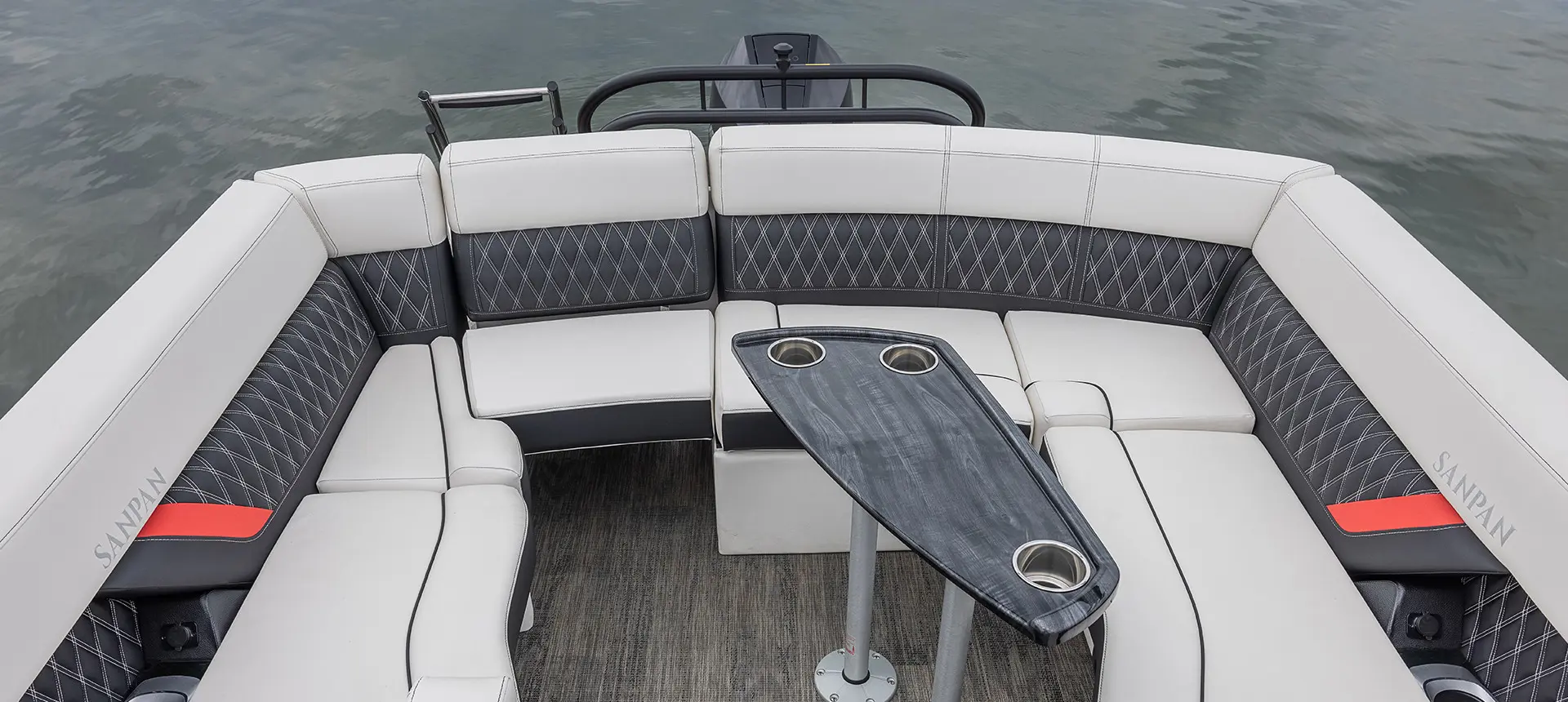ultra lounge and table on a godfrey sanpan lounge pontoon