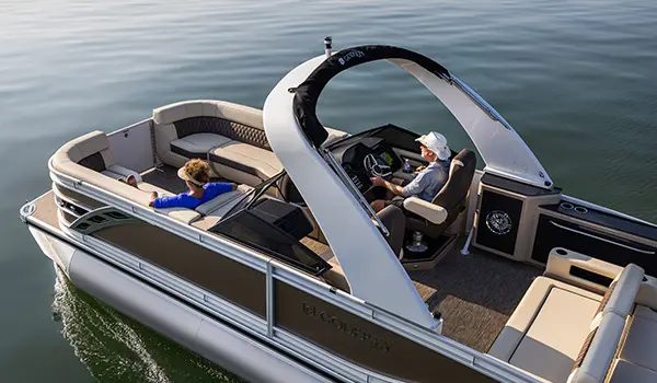 aerial view of a man and woman relaxing on a godfrey sanpan lounge pontoon