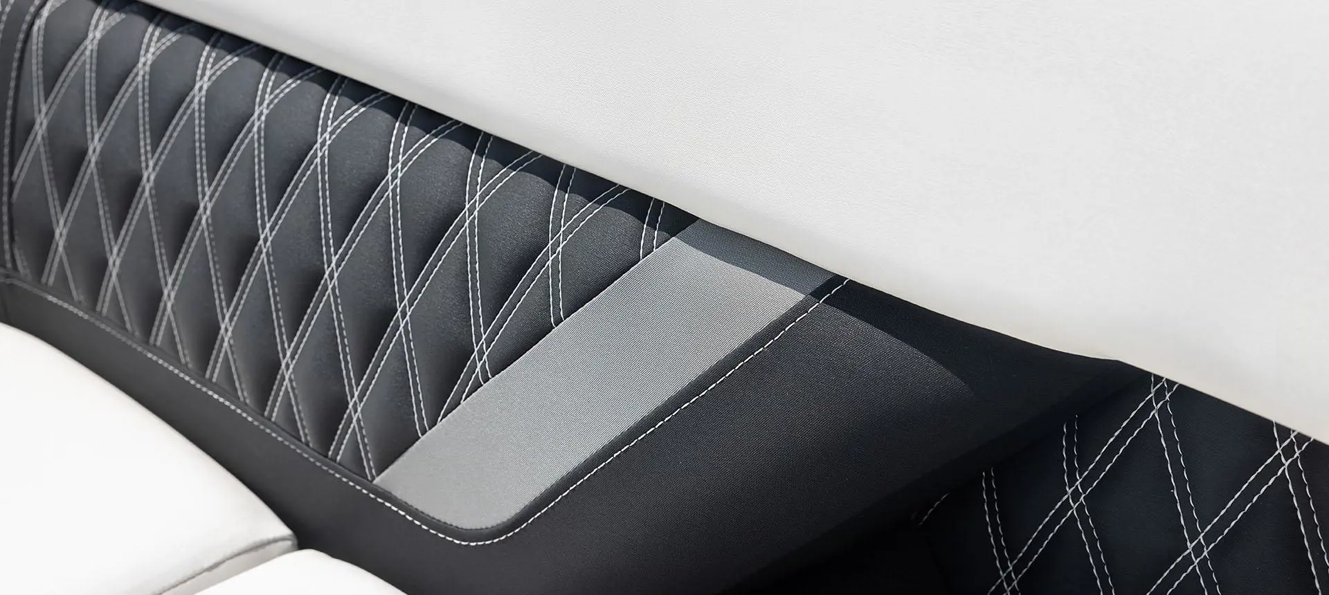 Premium seat stitching on a Godfrey Sanpan Twin tritoon.