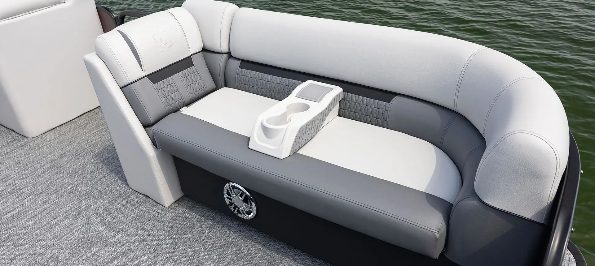 moveable cup holder on the split bench seats of a godfrey sweetwater lounge pontoon