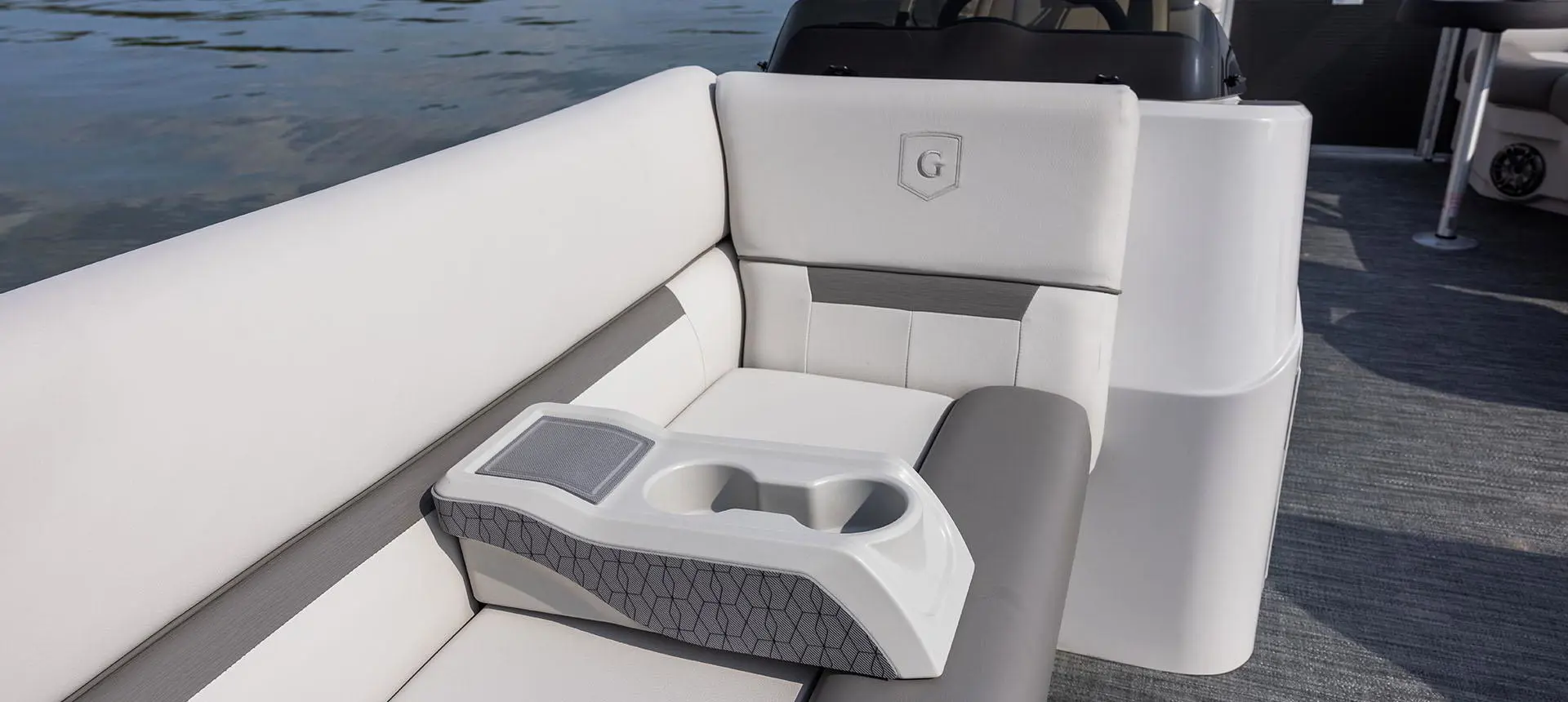 moveable cup holder on a split bench seat on a godfrey xperience split bench pontoon