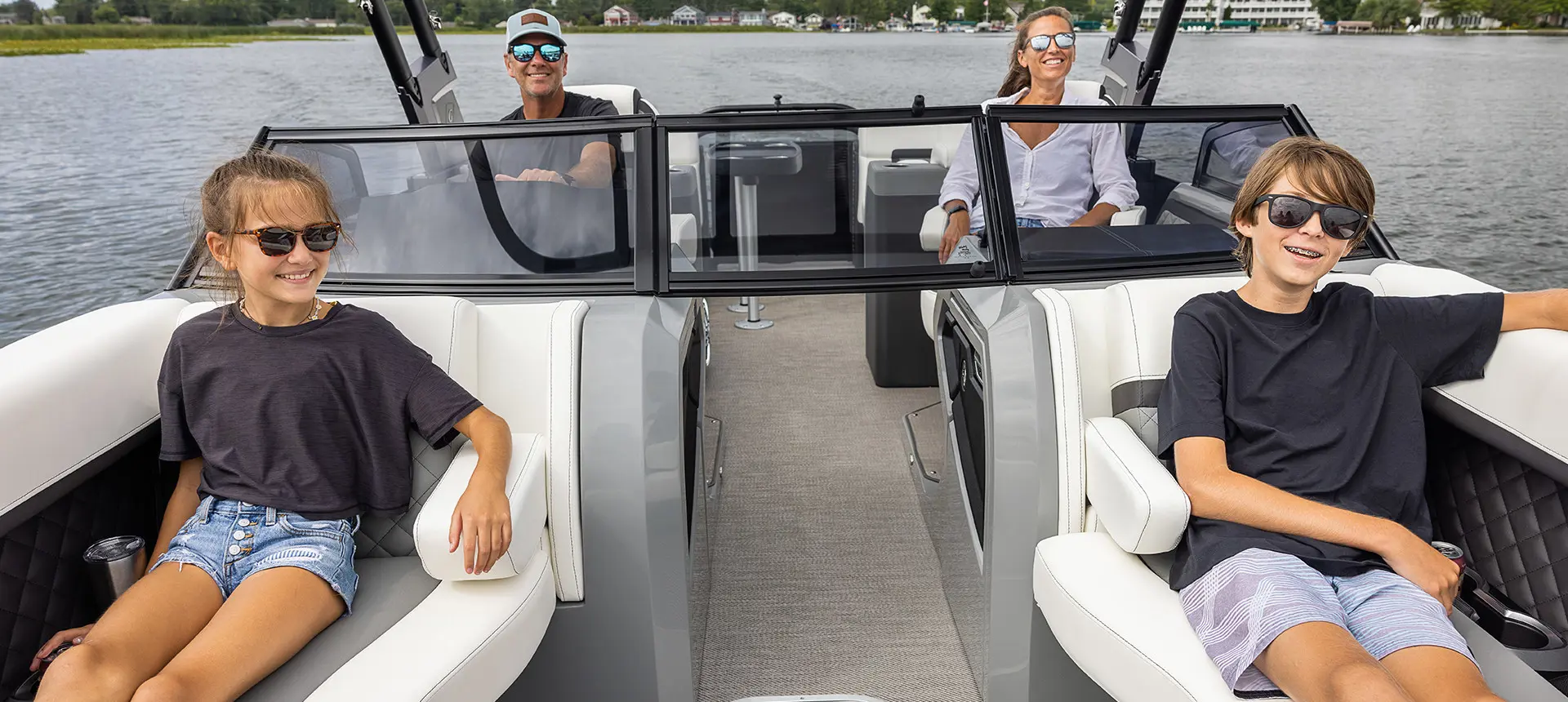 kids and parents relaxing on a godfrey aquapatio series pontoon