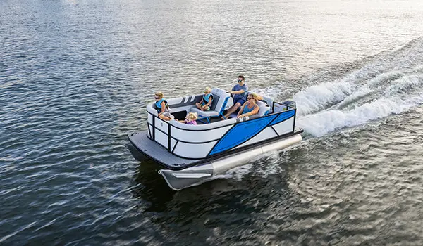 family cruising a lake on their godfrey mighty g cruise pontoon