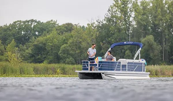 2 men fishing off the bow of a godfrey xperience fishing pontoon