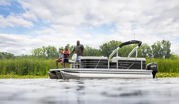family fishing off the bow of a godfrey xperience fishing pontoon