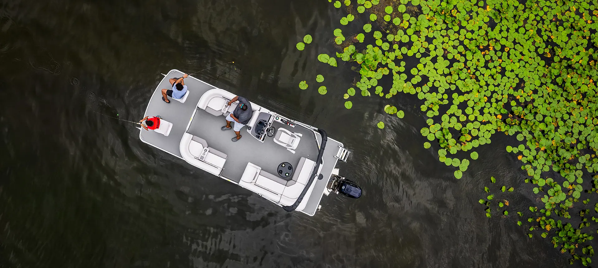aerial view of a family fishing with their godfrey xperience fishing pontoon