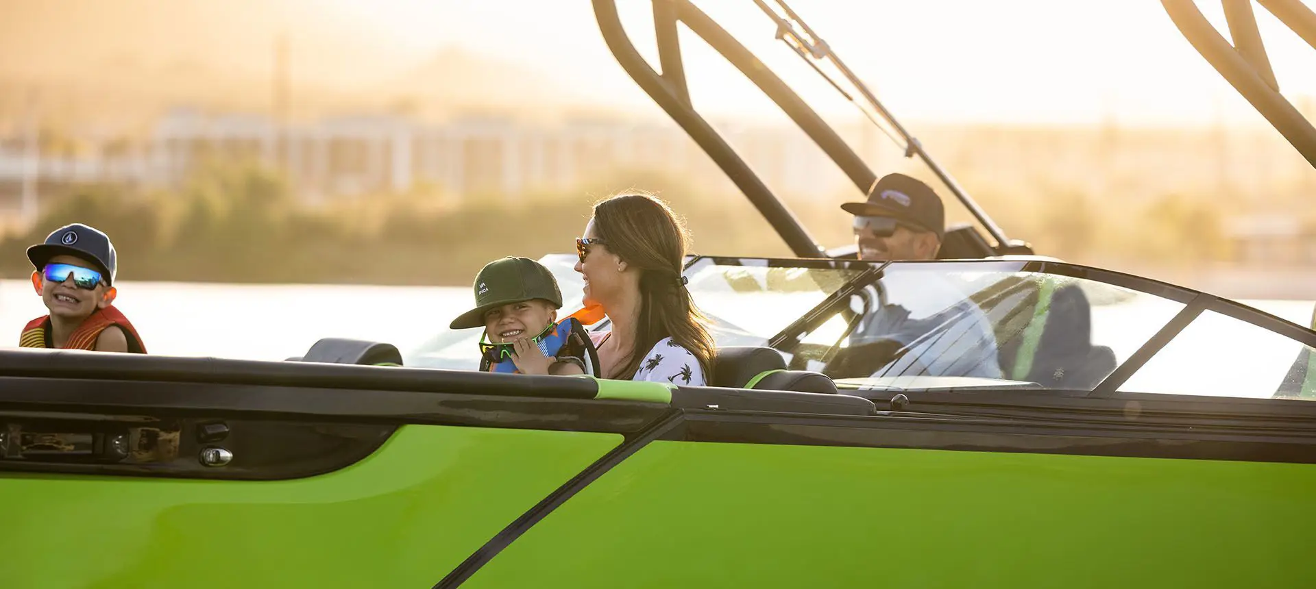 Family enjoying the lake on a Godfrey XP Tritoon boat.