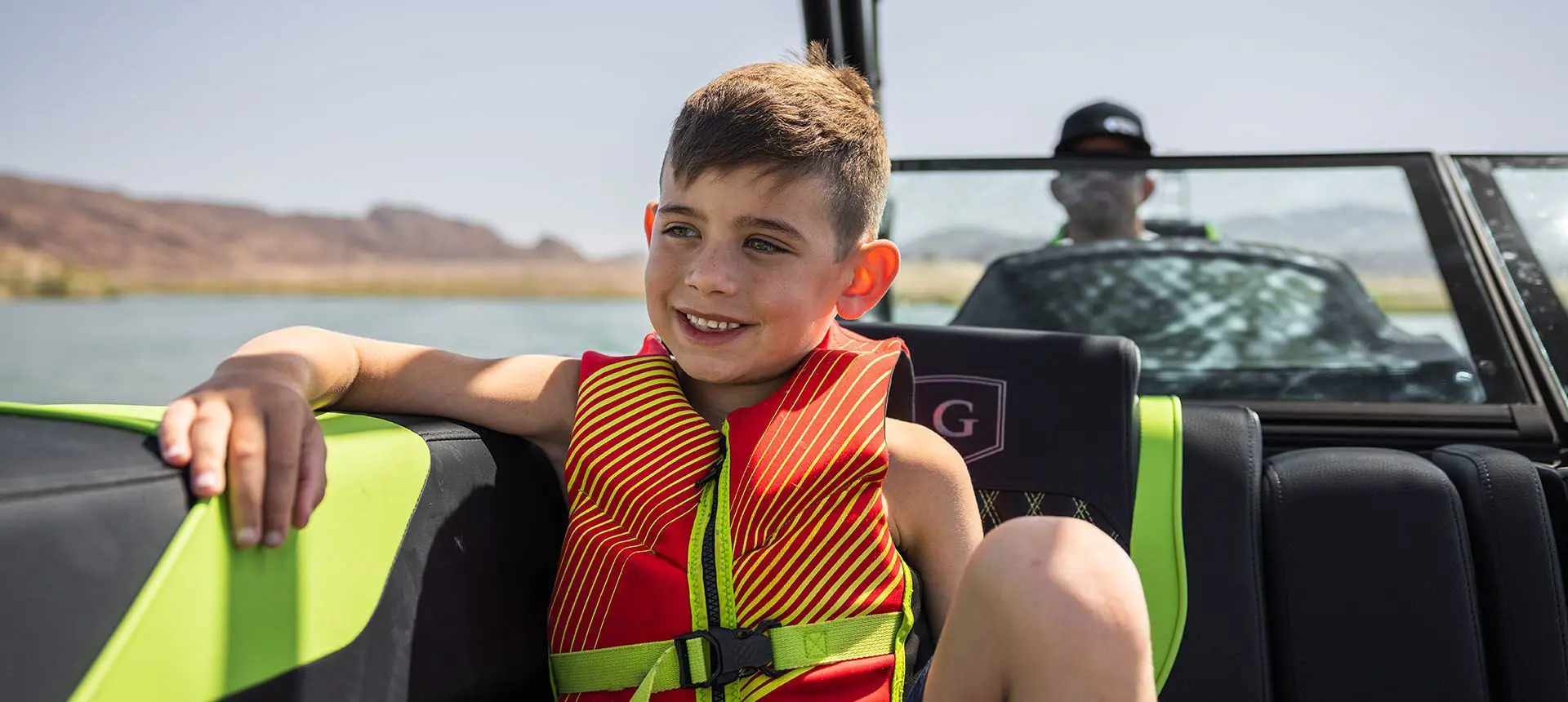 Boy enjoying his time on a Godfrey XP Tritoon boat.