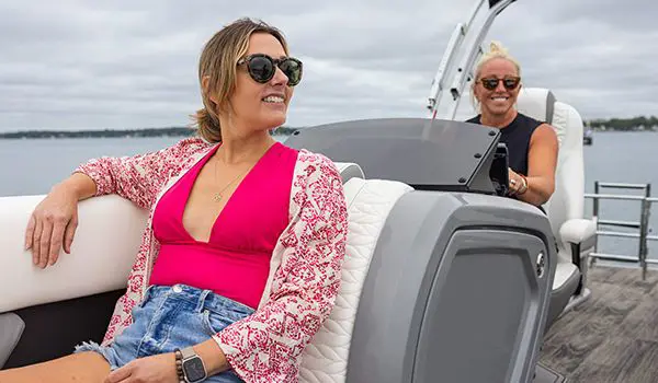 2 women on a godfrey monaco lounge pontoon