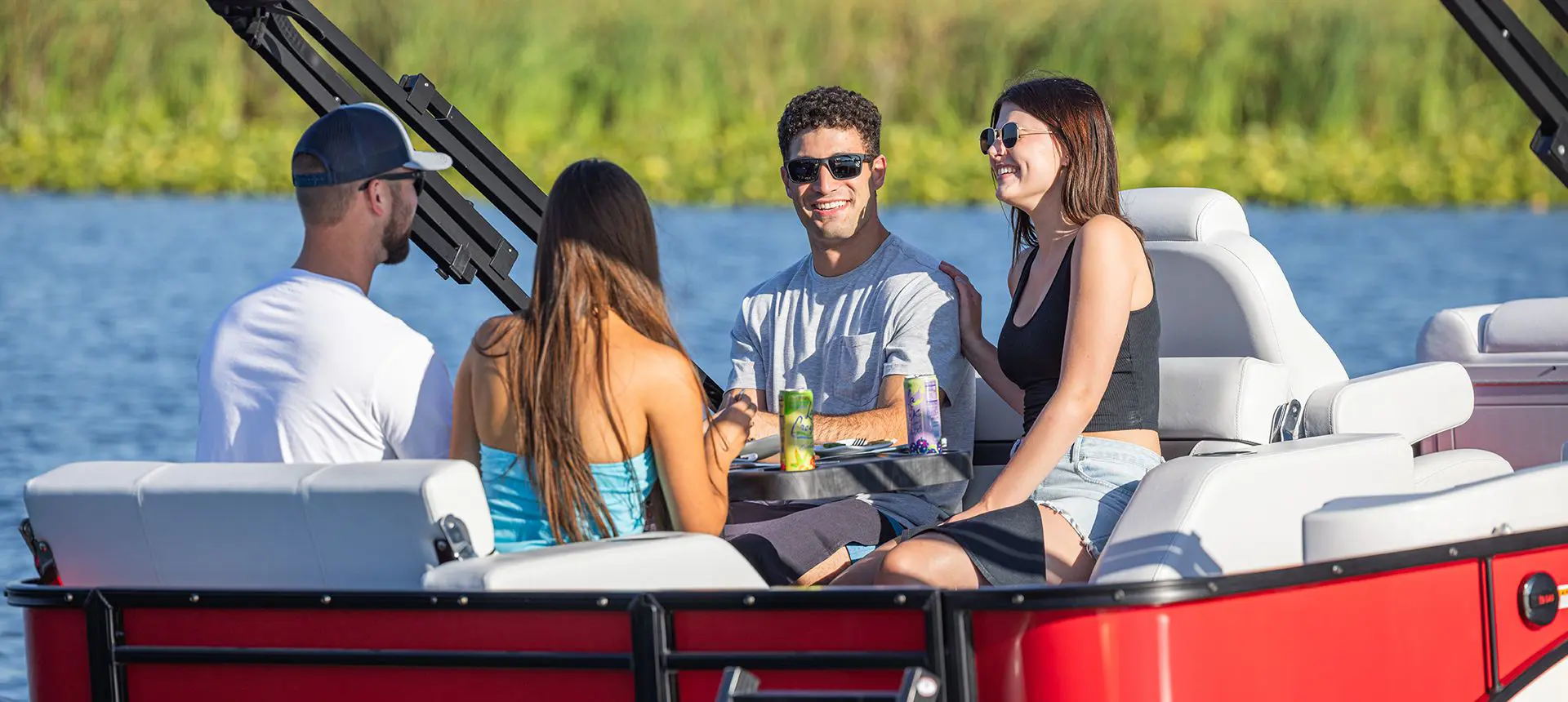 2 couples having a good time on a godfrey sweetwater entertainment pontoon
