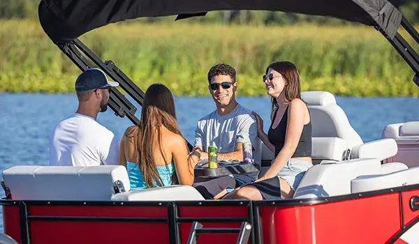 2 couples having a good time on a godfrey sweetwater entertainment pontoon