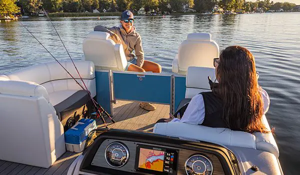 2 people ready to fish on a godfrey sweetwater fishing pontoon