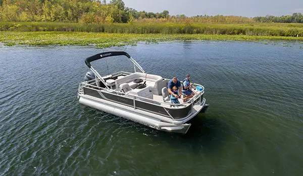 dad fishing with his sons off the bow of a godfrey xperience fishing pontoon