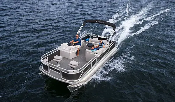 dad and sons cruising on a godfrey xperience fishing pontoon