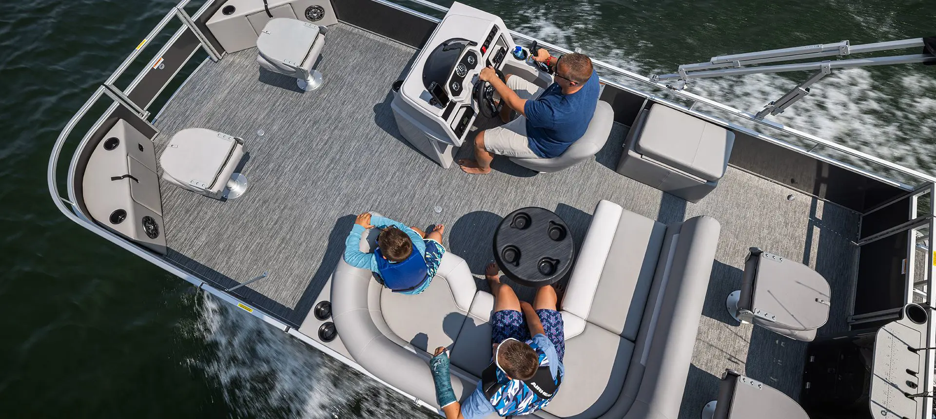 aerial view of a family on a godfrey xperience fishing pontoon