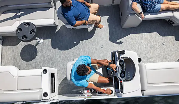 aerial view of a family having a good time on a godfrey xperience split bench pontoon