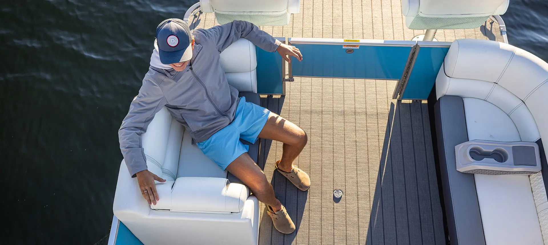 woman relaxing on a godfrey sweetwater pontoon