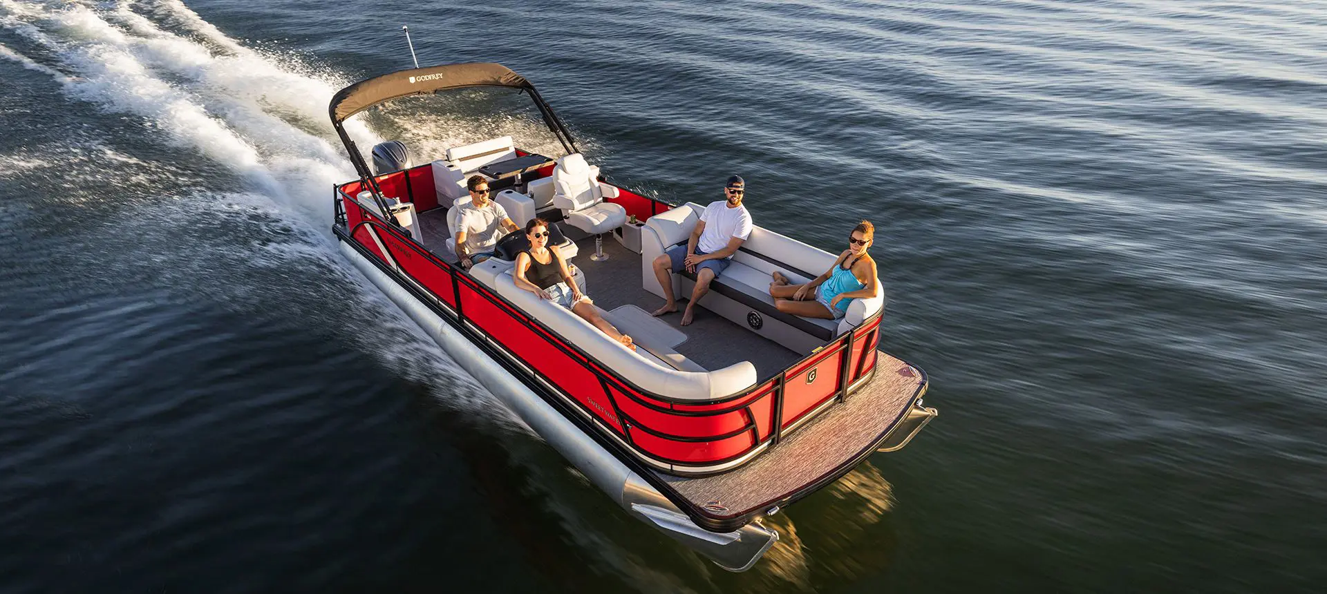 woman relaxing on the swingback seat on a godfrey sweetwater pontoon