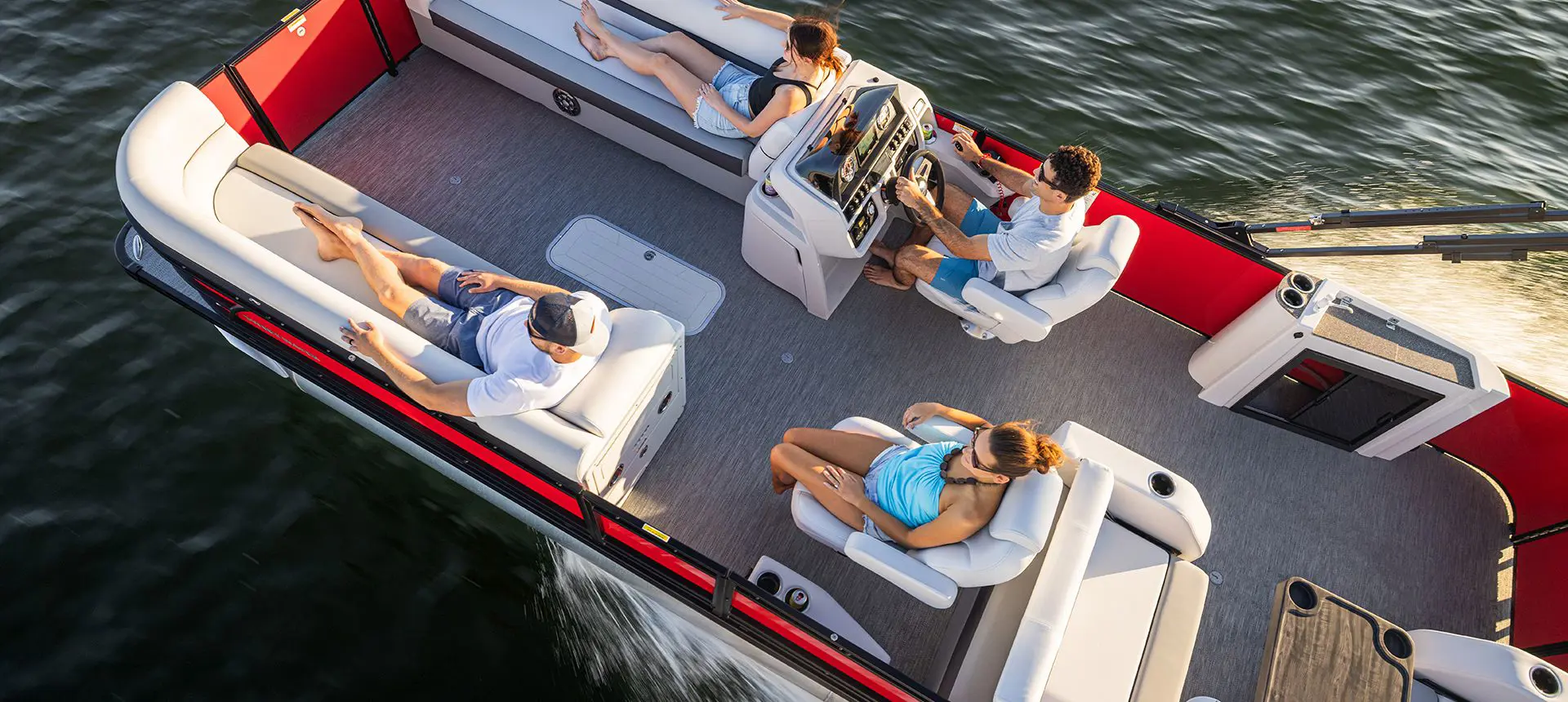 couple relaxing on a docked godfrey sweetwater pontoon