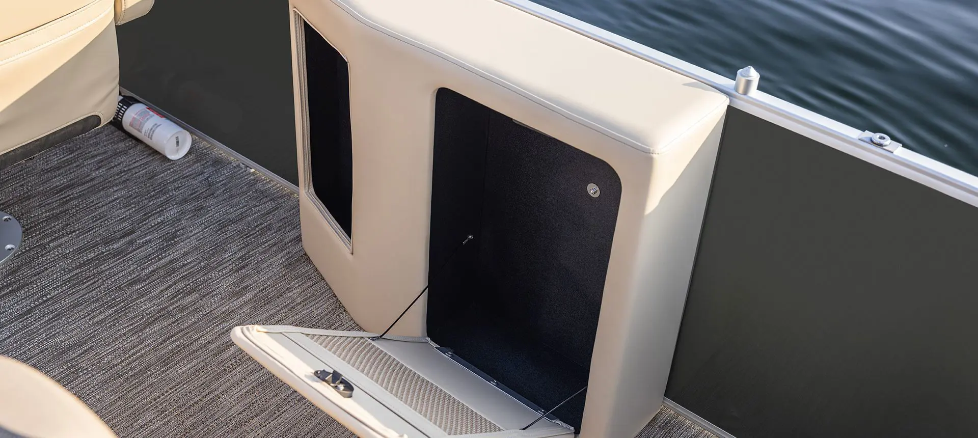 Integrated storage options on a Godfrey Sweetwater Cruise pontoon boat.