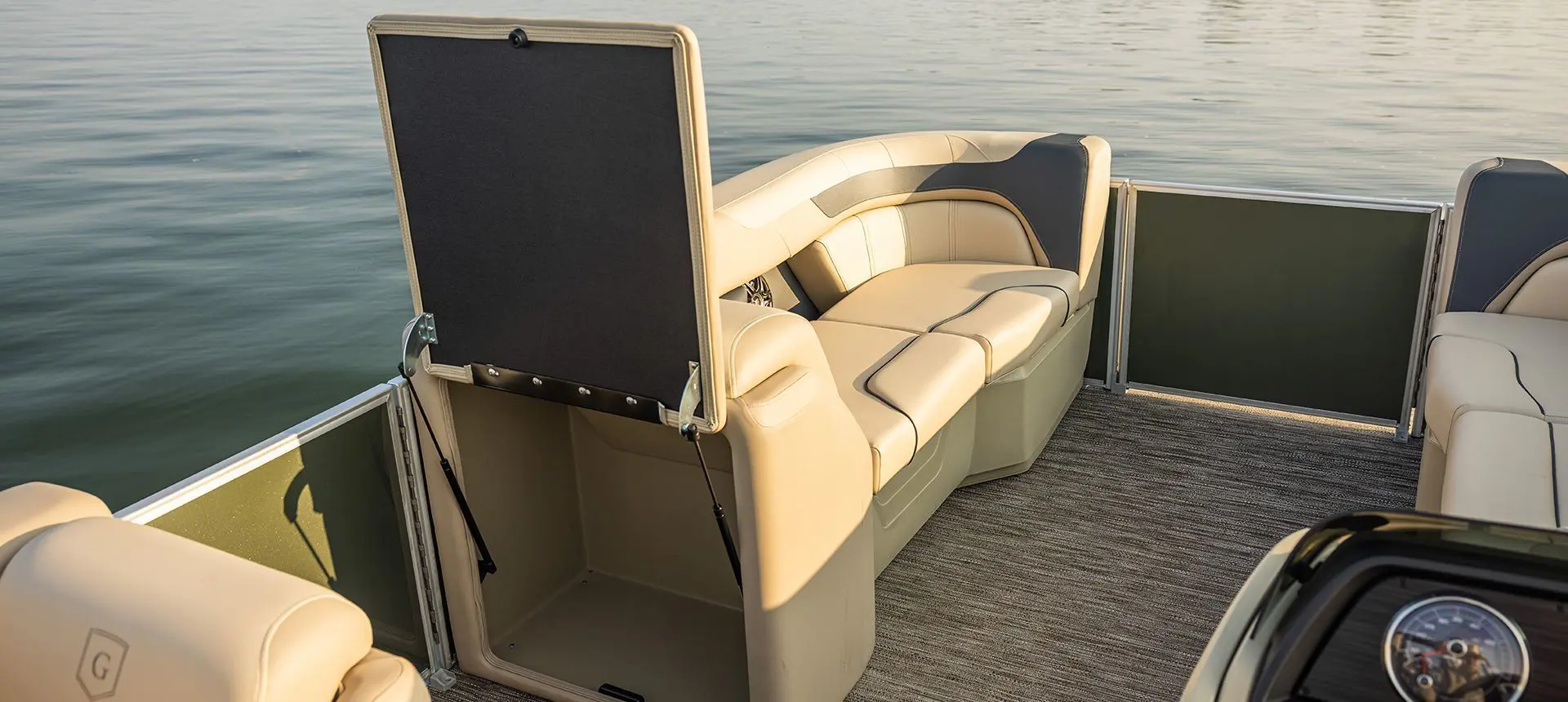 Integrated storage options on the bow of a Godfrey Sweetwater Cruise pontoon boat.