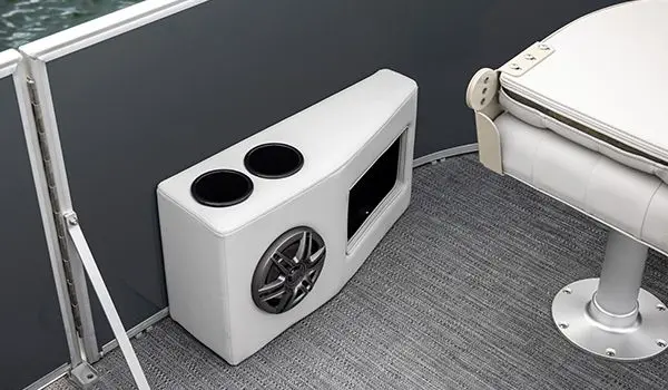 Integrated speakers and cupholders on a Godfrey Sweetwater Fishing pontoon boat.