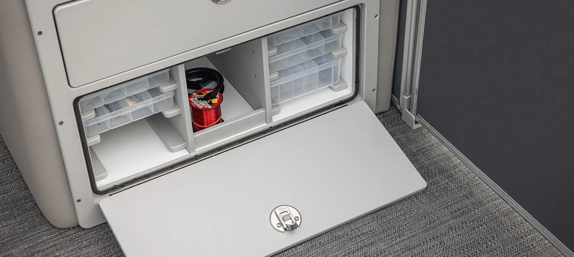Integrated tackle storage on a Godfrey Sweetwater Fishing pontoon boat.