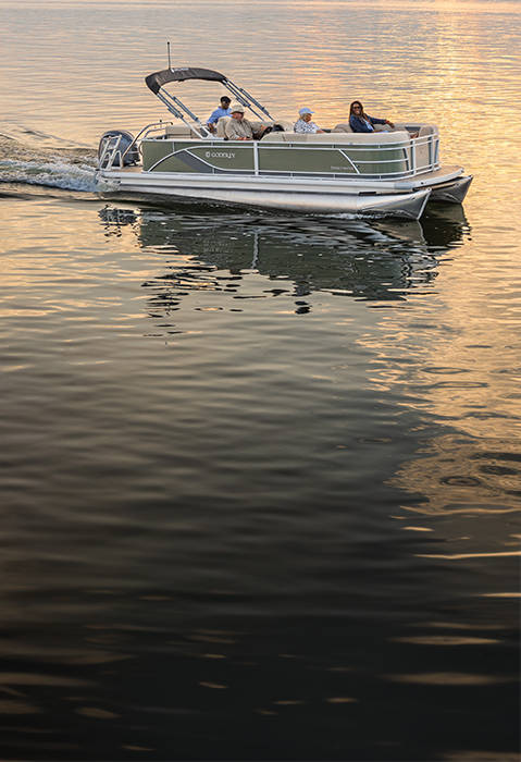 Godfrey Sweetwater Special Edition pontoon cruising at sunset. 